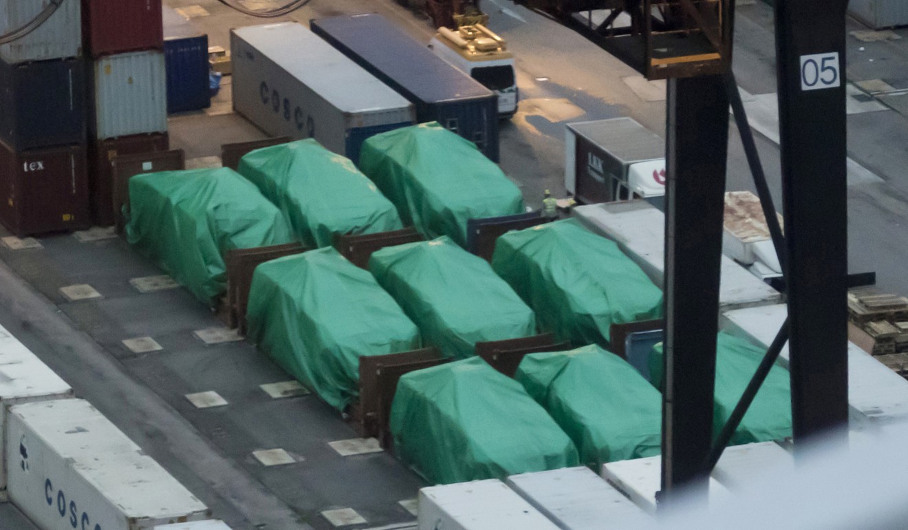 Nine covered Singapore-made Terrex infantry carrier vehicles are temporarily detained at a container terminal in Hong Kong. Photo: AP