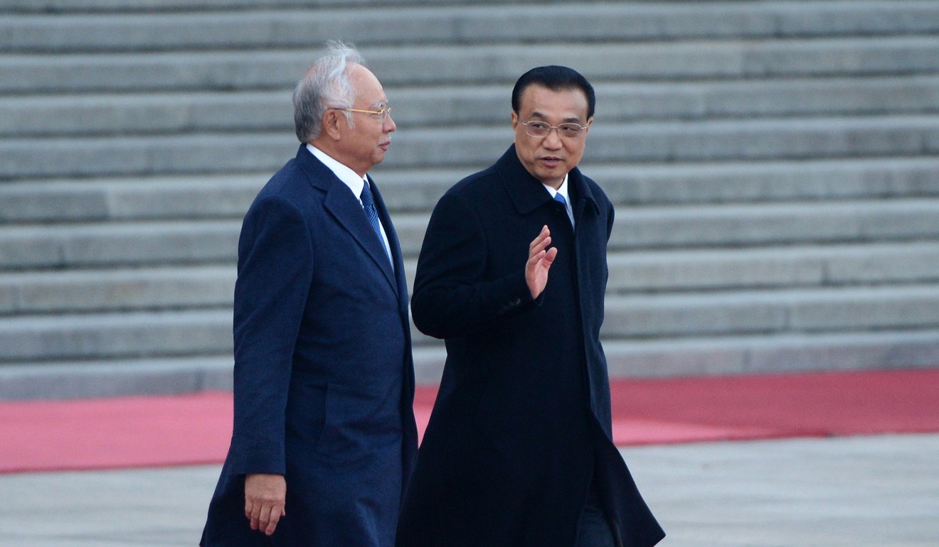 Malaysian Prime Minister Najib Razak and Chinese Premier Li Keqiang meet in Beijing. Malaysia is to receive 400 billion ringgit in Chinese investment over the next two decades. Photo: AFP