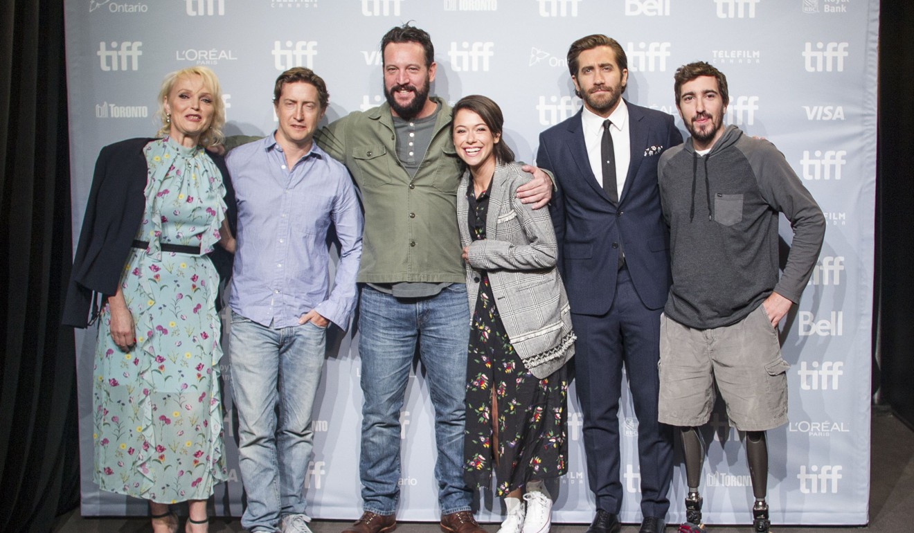 The cast of Stronger (from left) Miranda Richardson, David Gordon Green, John Pollono, Tatiana Maslany, and Jake Gyllenhaal pose with Jeff Bauman at the Toronto International Film Festival. Photo: AFP