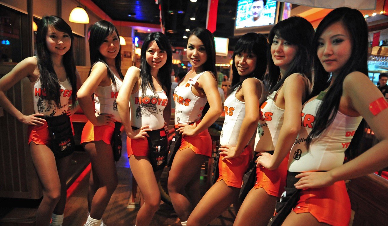 Waitresses at a Hooters bar in Beijing. 
