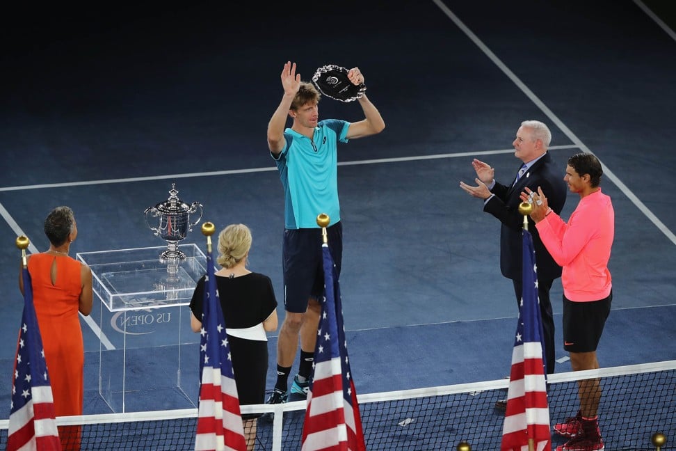 Anderson poses with his runners-up trophy at the ceremony following the US Open final. Photo: AFP