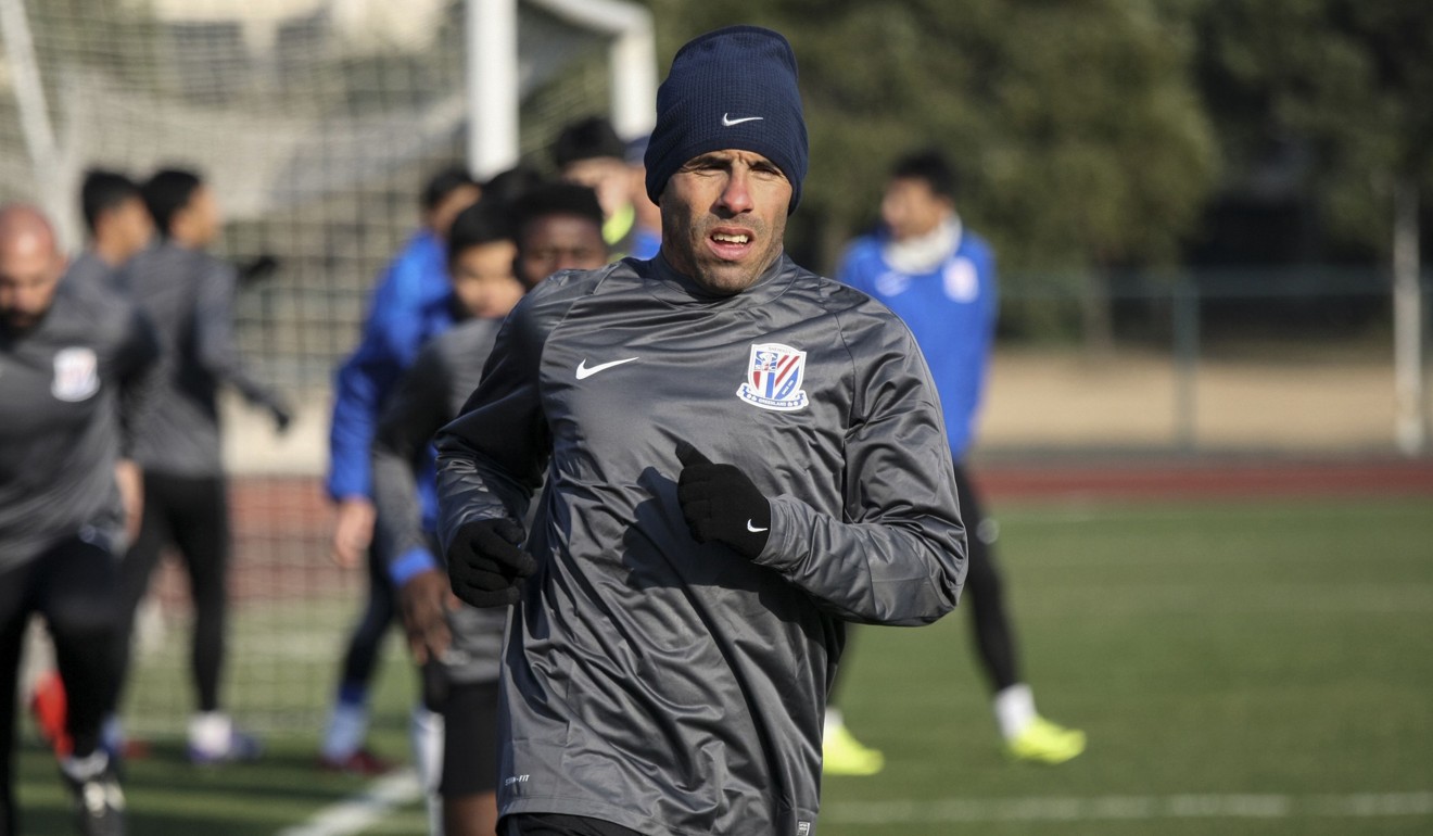 Carlos Tevez taking part in his first training session with Shanghai Shenhua in January. Photo: AFP