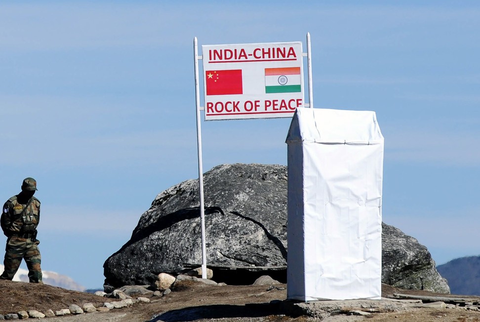 An Indian soldier keeps watch at the border pass of Bum La in Arunachal Pradesh state, which China claims as South Tibet, in October 2012. Photo: AFP