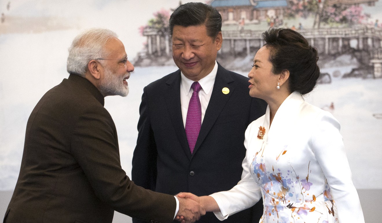 Indian Prime Minister Narendra Modi greets China’s first lady Peng Liyuan as President Xi Jinping looks on, during the BRICS summit in Xiamen, Fujian province, on September 4. Photo: AP
