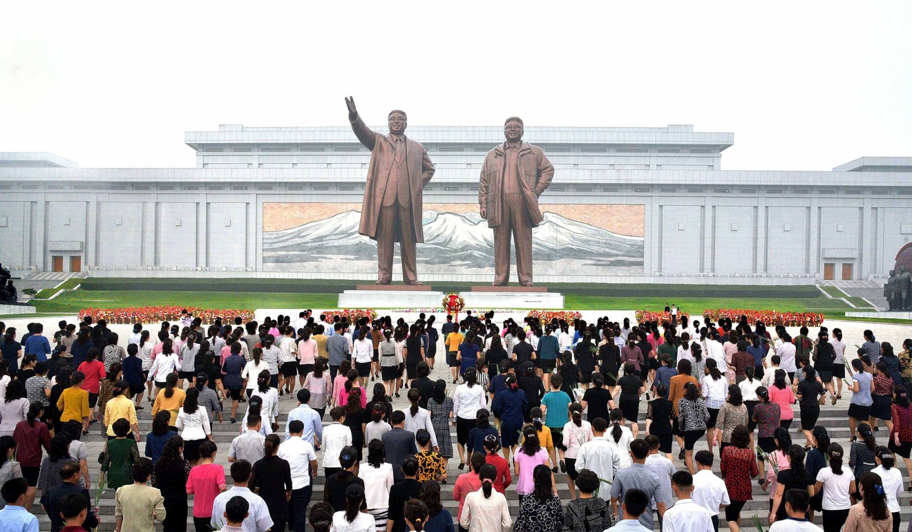 North Koreans pay tribute at the monuments of late leaders Kim Il-sung and Kim Jong-il in Pyongyang on Saturday, marking the 69th anniversary of the North Korean government's establishment. Photo: EPA-EFE/Yonhap