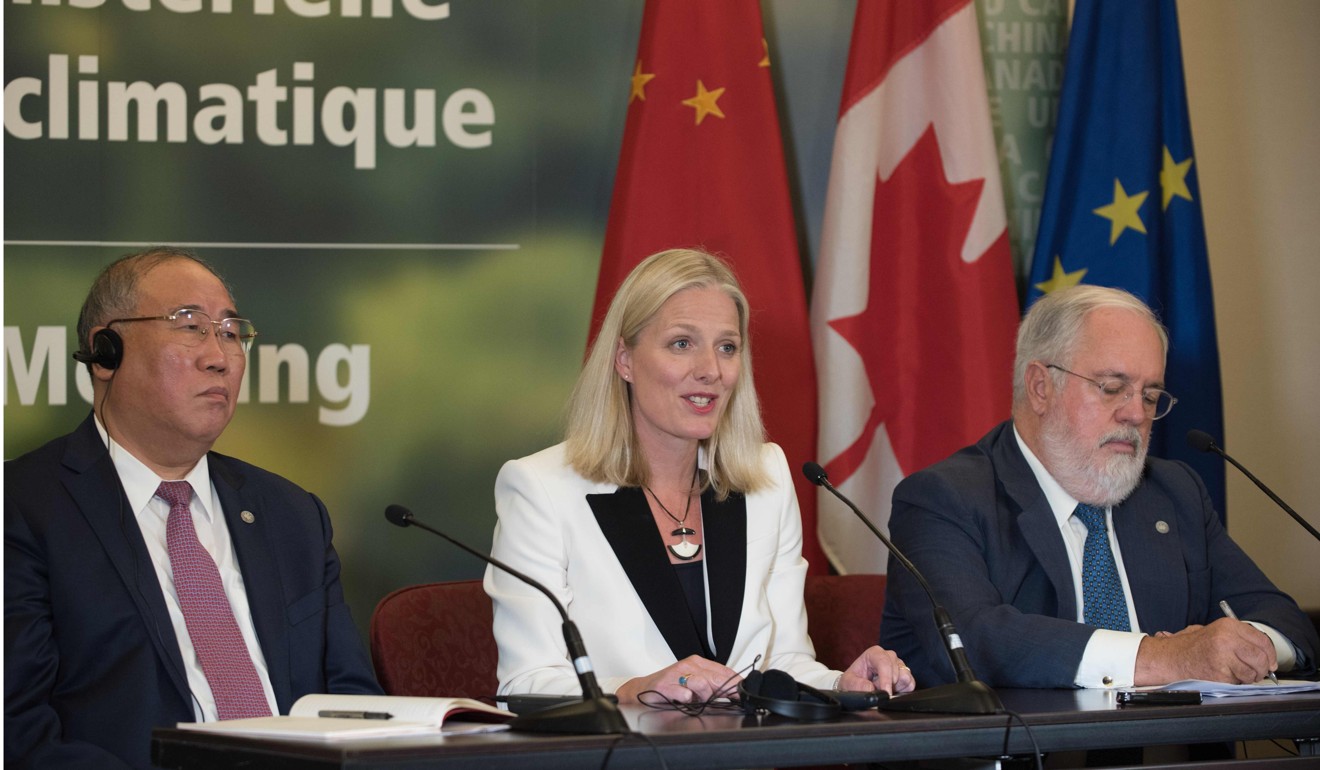 From left, China's representative on climate change Xie Zhenhua, Canadian environment minister Catherine McKenna and European Union commissioner for climate change and energy Miguel Arias Canete speak to the press after a ministerial meeting on September 16 in Montreal to push forward on implementing the Paris climate accord even without the United States. Photo: AFP