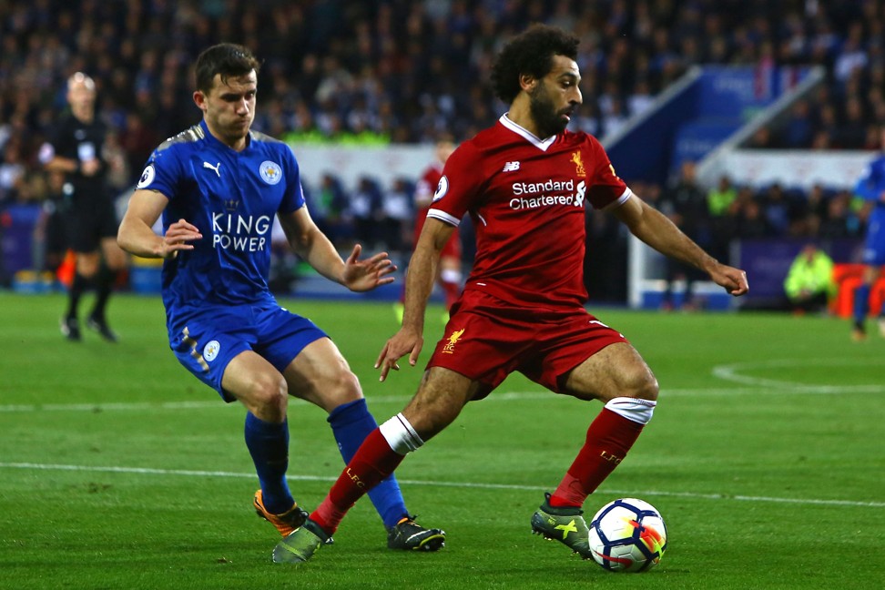 Liverpool’s Mohamed Salah vies with Leicester City’s Ben Chilwell. Photo: AFP