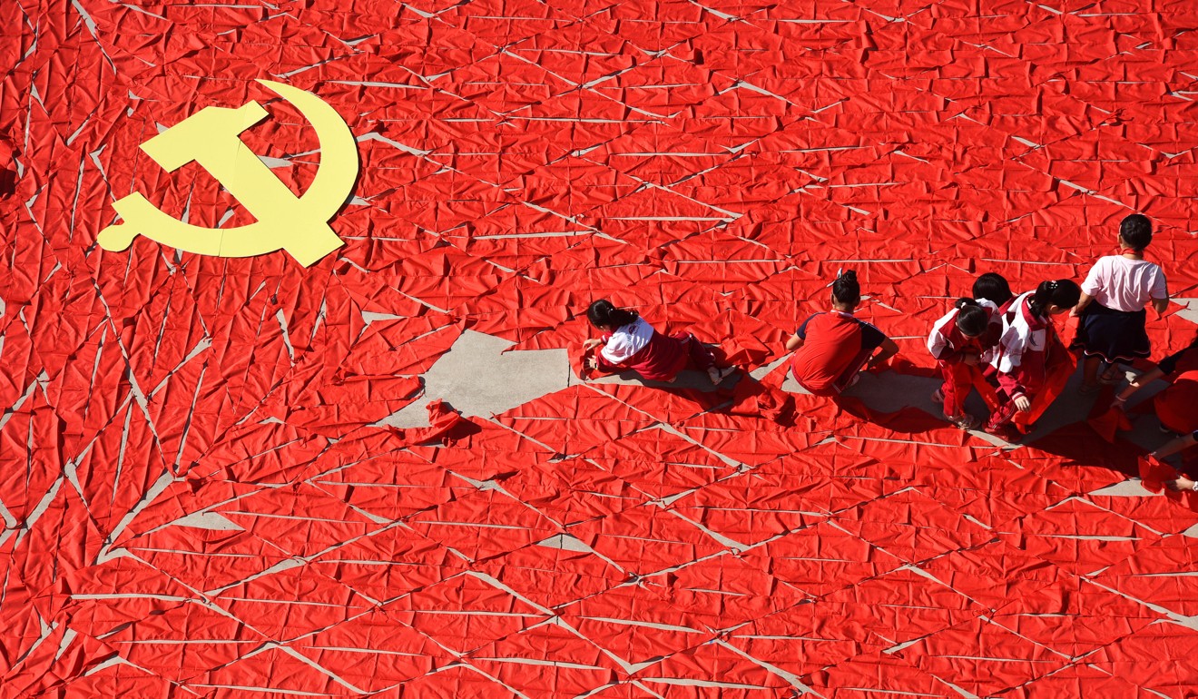 Students use red scarves to make a flag of the Communist Party of China, ahead of the 19th party congress, at a primary school in Linyi, Shandong province. The 19th congress should speed up implementation of market-oriented reforms, bringing China’s policies into line with its vision of an open, rules-based and fair global economy. Photo: Reuters