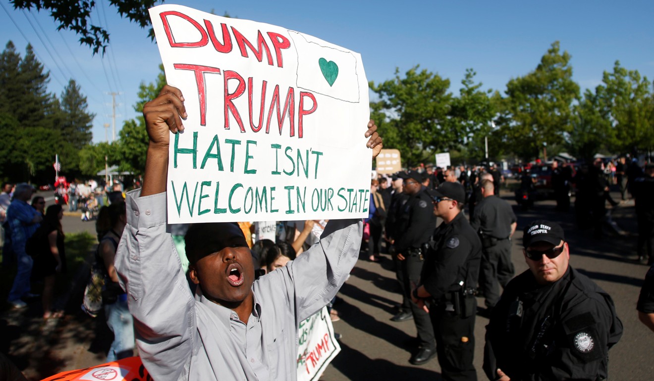A demonstrator protests before the arrival of then presidential candidate Donald Trump at a campaign rally in Eugene, Oregon. Fake reports that anti-Trump protesters were being paid were spread by Trump’s campaign manager. Photo: Reuters