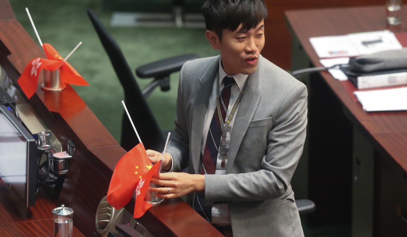 Cheng Chung-tai upends the flags in the Legco chamber last year. Photo: K.Y. Cheng
