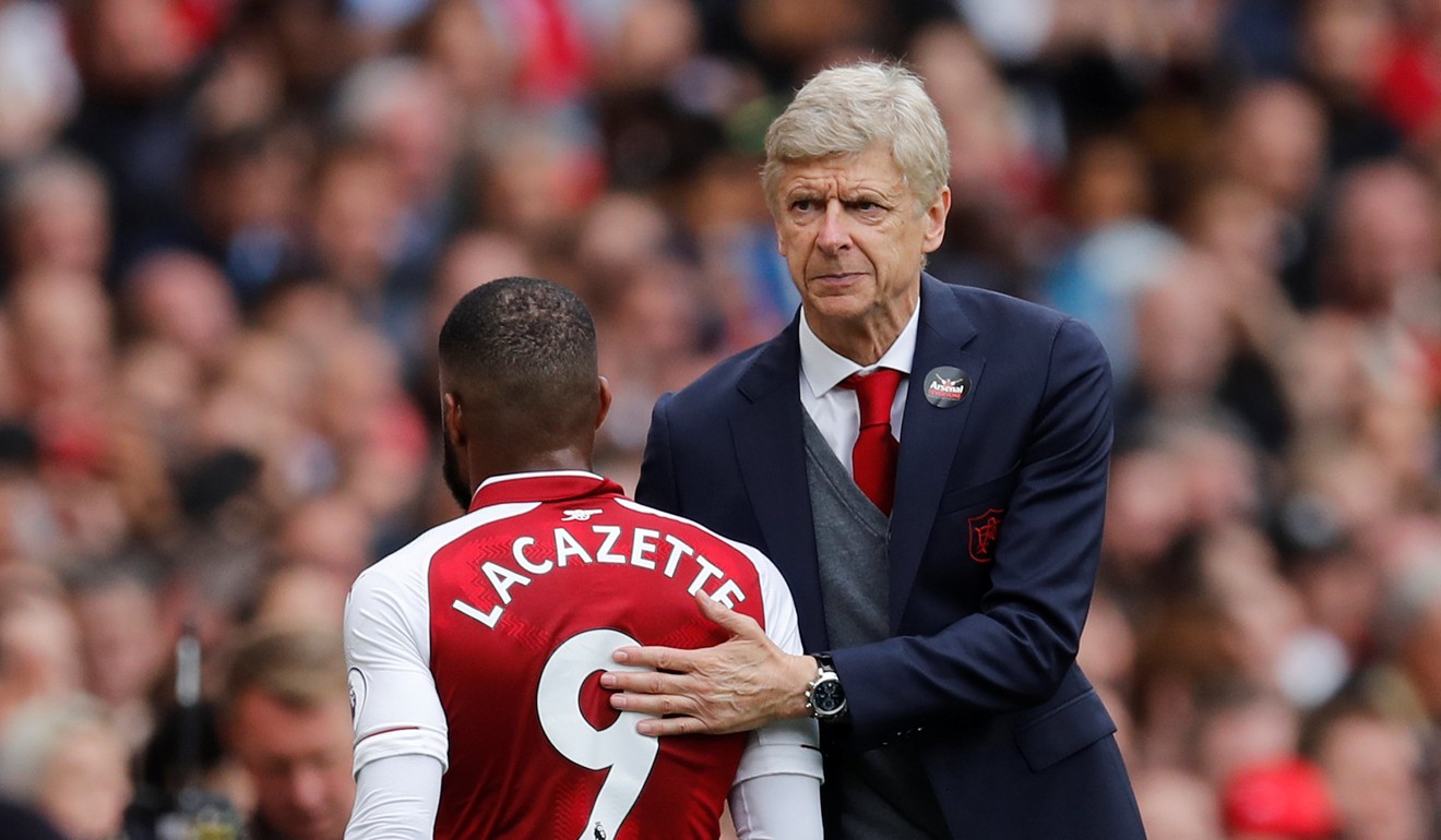 Arsenal's Alexandre Lacazette is congratulated by manager Arsene Wenger as he walks off to be substituted. Photo: Reuters