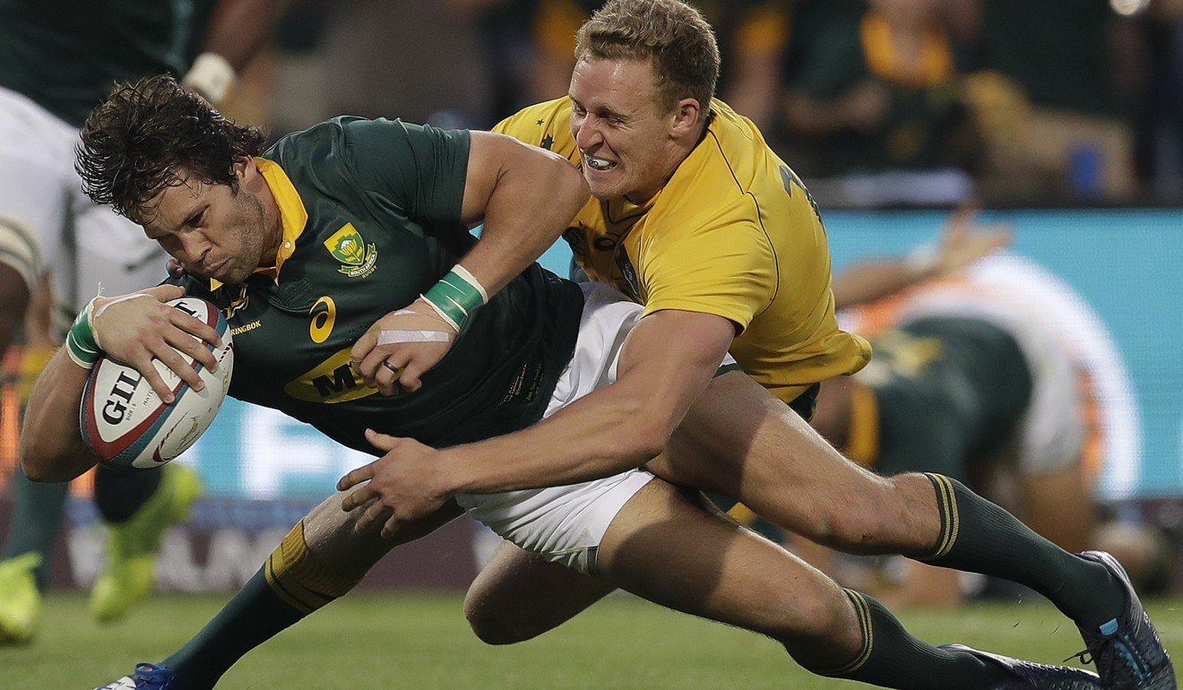 South Africa’s Jan Serfontein scores despite Reece Hodge’s best efforts. Photo: AP