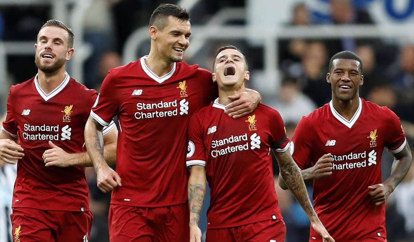 Philippe Coutinho is grabbed by Dejan Lovren, and accompanied by Jordan Henderson and Georginio Wijnaldum after his 30-yard stunner. Photo: Reuters