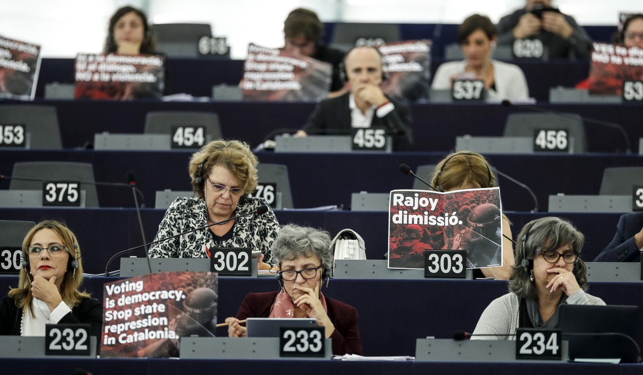Parliamentarians display posters in support of the disputed independence vote in Catalonia during a session at the European Parliament in Strasbourg, eastern France, on Wednesday,. Photo: AP