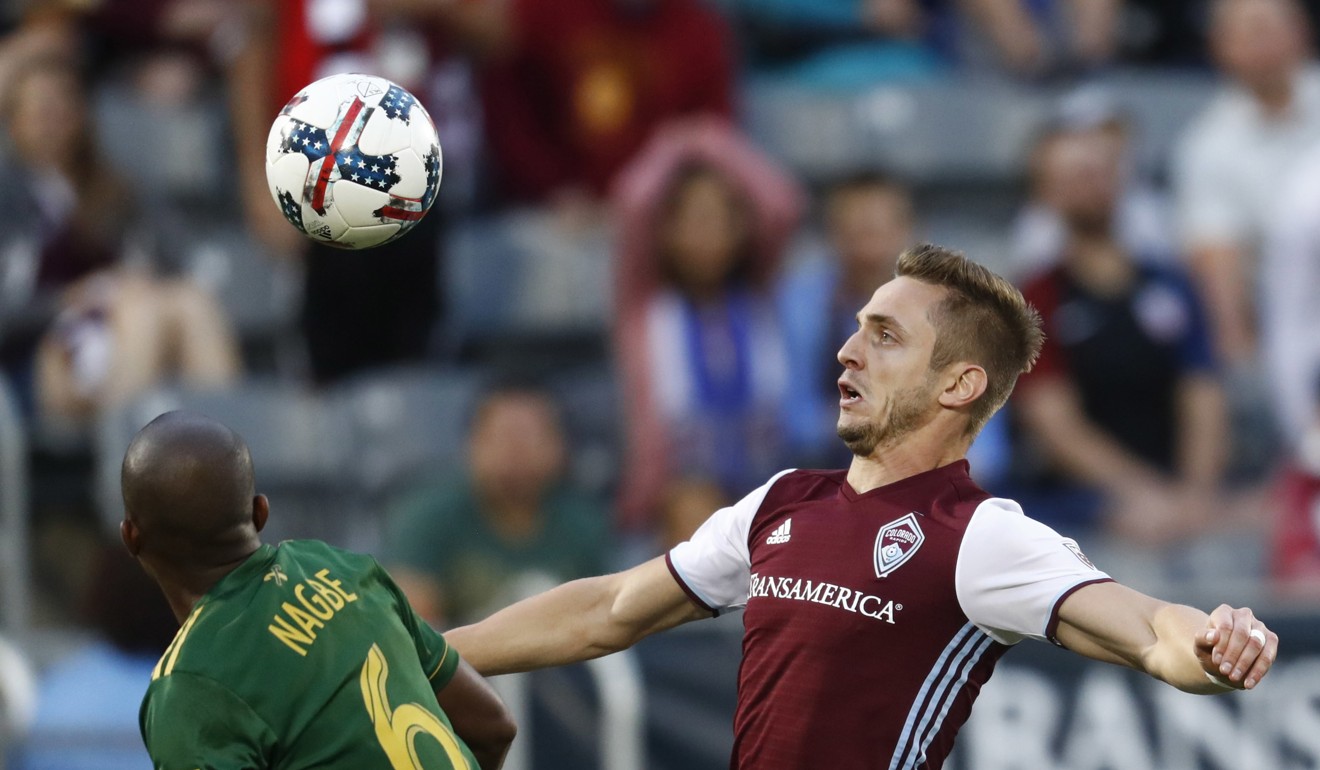 Kevin Doyle (right) goes up for a trademark header. Photo: AP
