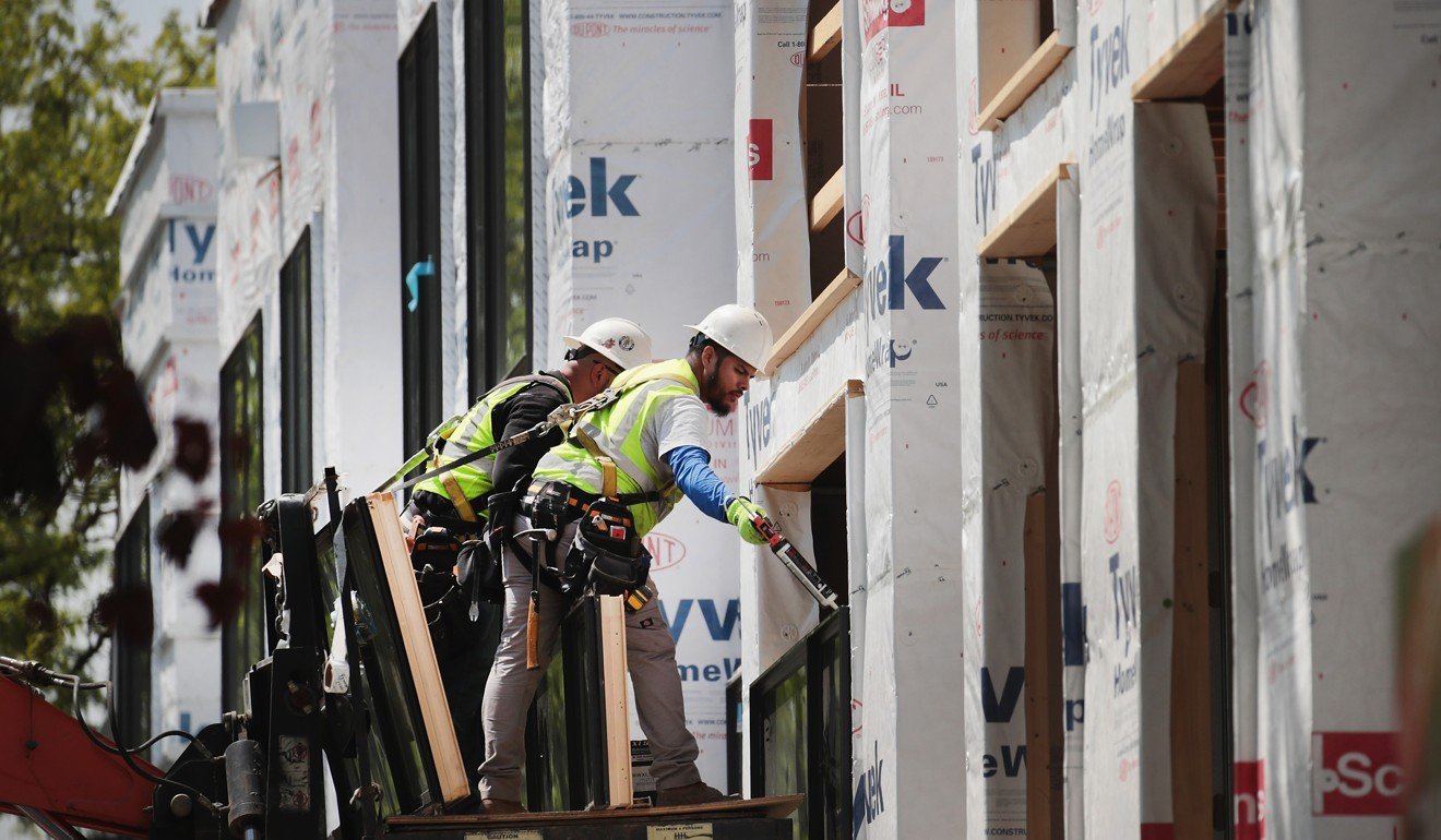 Workers installing windows in a town house complex under construction in Chicago, Illinois. Photo: AFP