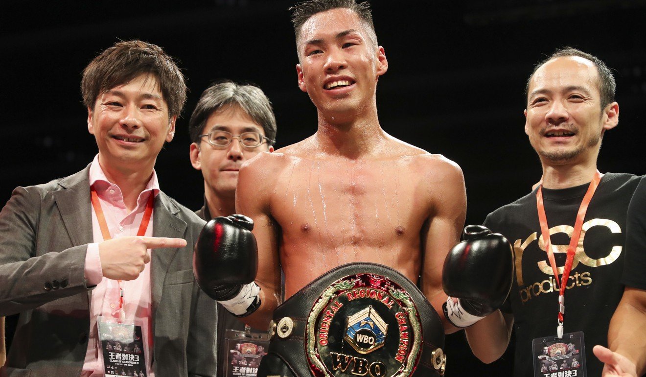 Japan's Takuya Watanabe with the winner’s belt. Photo: Edward Wong