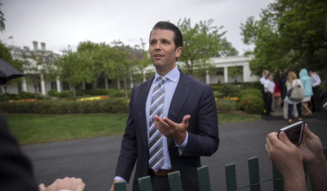 Donald Trump Jnr talks to reporters at the White House. Photo: EPA