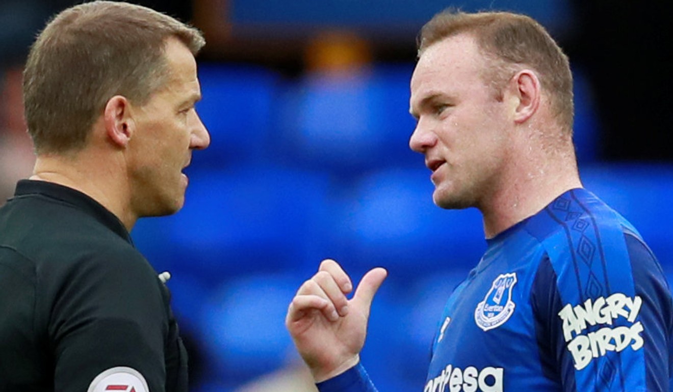 Everton followed Liverpool’s example by signing a deal with a sleeve sponsor, as seen on Wayne Rooney’s (right) shirt. Photo: Reuters