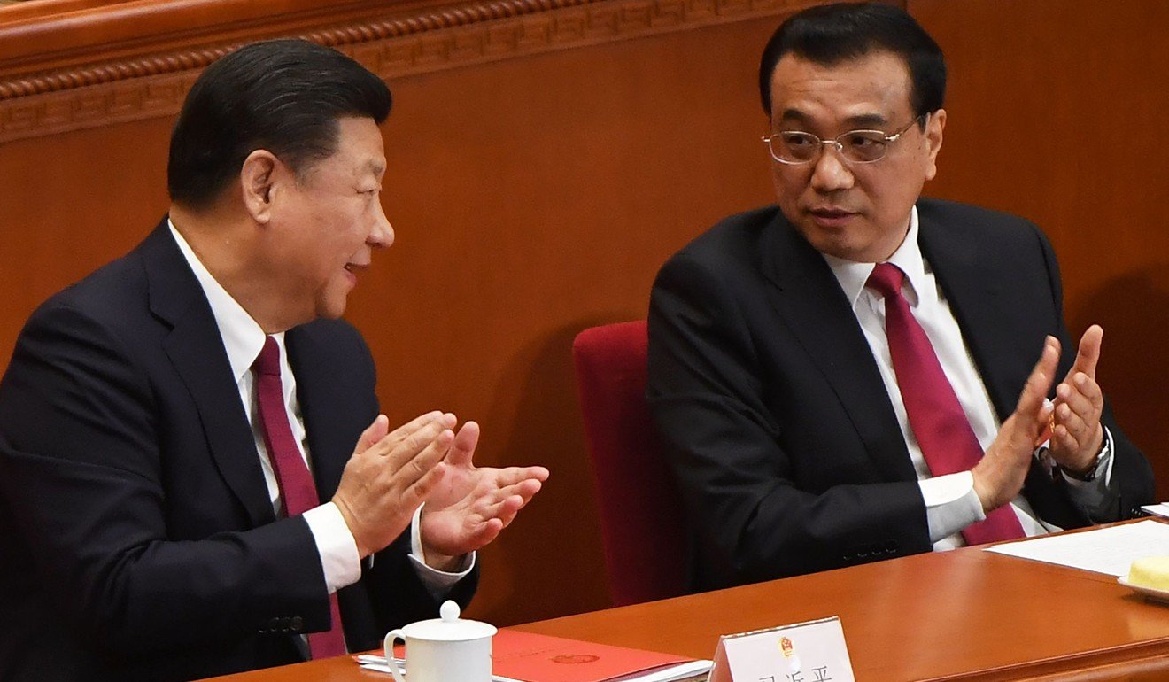 President Xi Jinping (left) and Premier Li Keqiang chat during the closing session of the annual meeting of the National People's Congress in Beijing in March. Photo: AFP