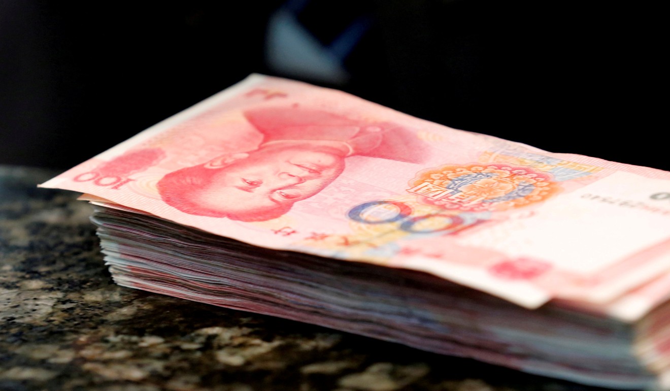 Central bank chief Zhou Xiaochuan says China should seize the moment to let the market decide the yuan’s value and scrap capital account controls. Photo: Reuters