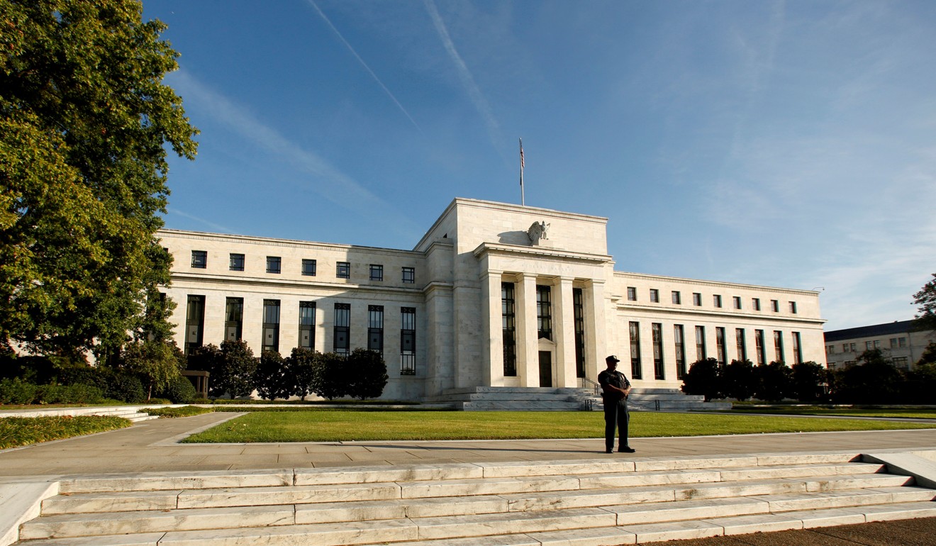 A police officer keeps watch in front of the US Federal Reserve building in Washington. Photo: Reuters