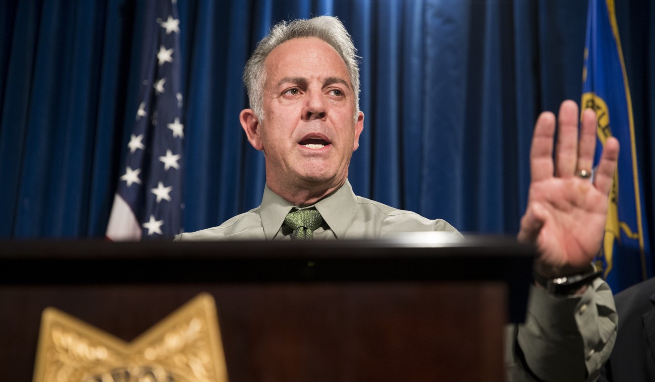 Clark County Sheriff Joe Lombardo says Las Vegas gunman Stephen Paddock shot and wounded a security guard outside his hotel room and opened fire through his door around 9.59pm – six minutes before shooting into the crowd. Photo: AP
