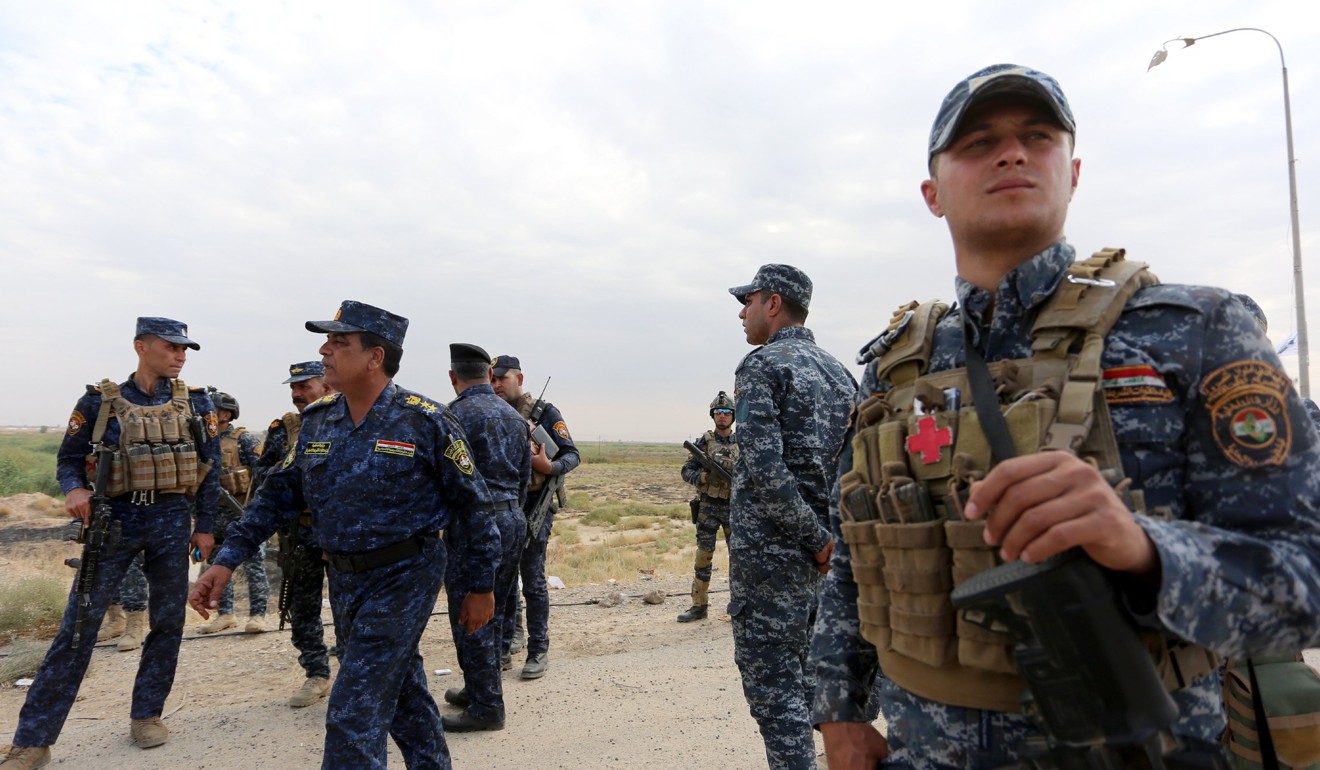 Iraqi federal police forces take up position in Rashad town, southern Kirkuk. Photo: EPA-EFE
