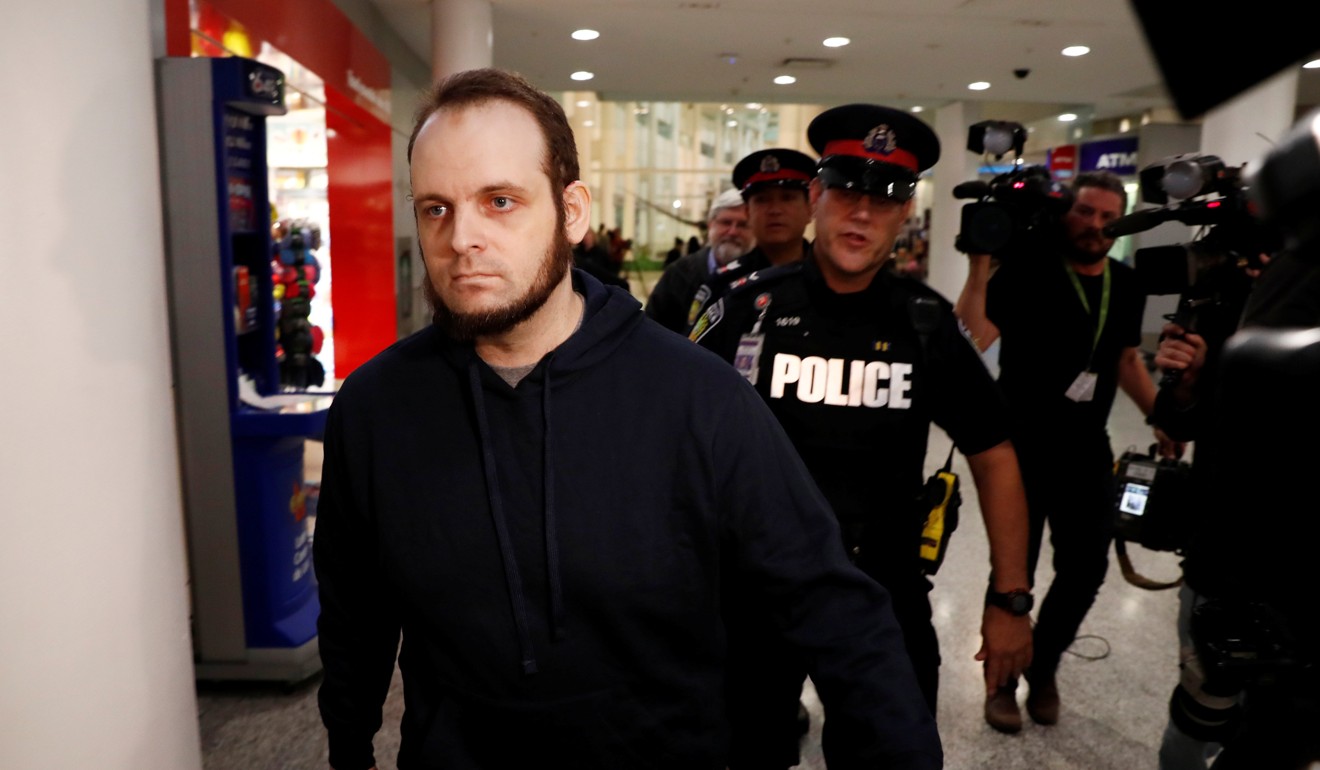 Joshua Boyle walks through the terminal after arriving with his wife and three children at Toronto airport on October 13, 2017. Photo: Reuters