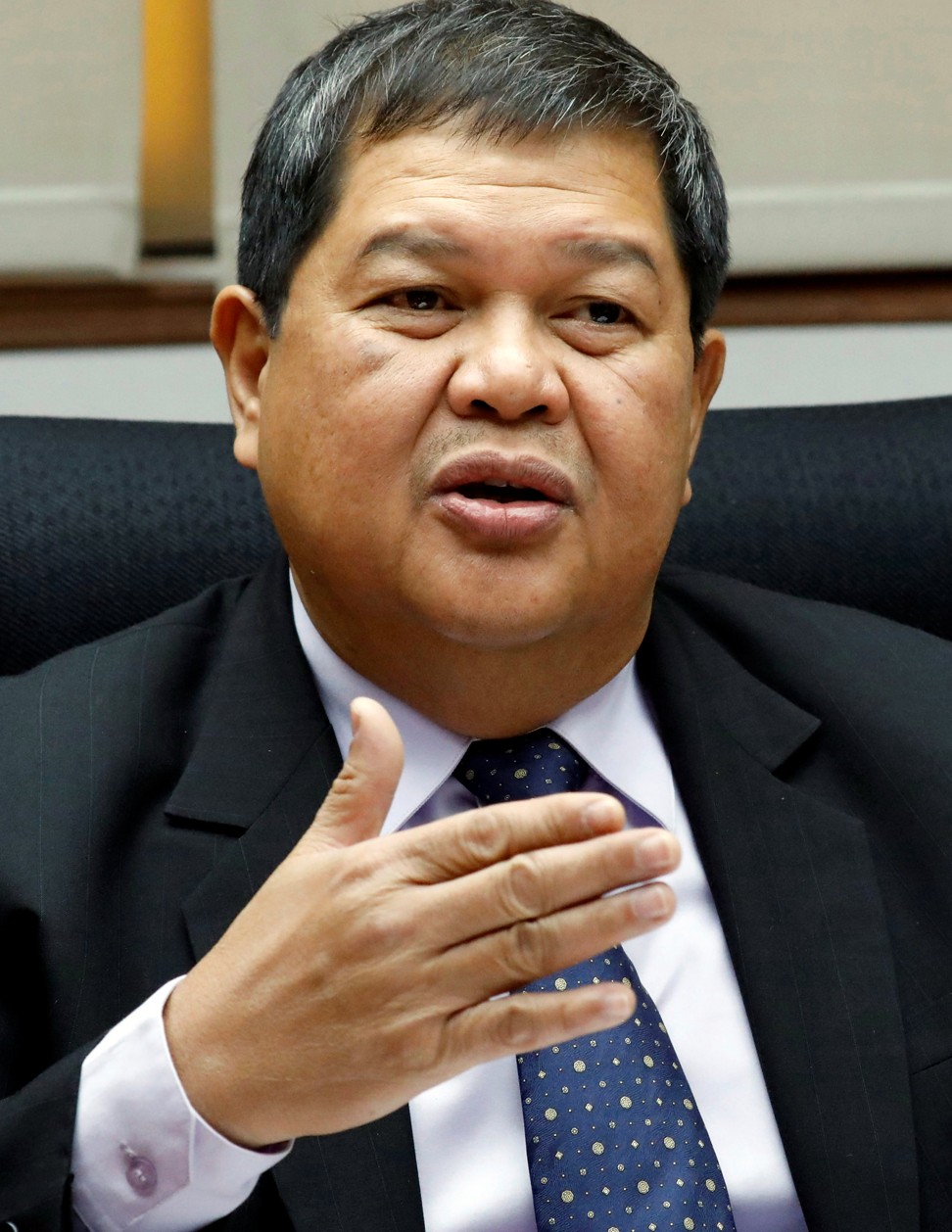 Philippine Central Bank governor Nestor Espenilla gestures during an interview. Photo: Reuters