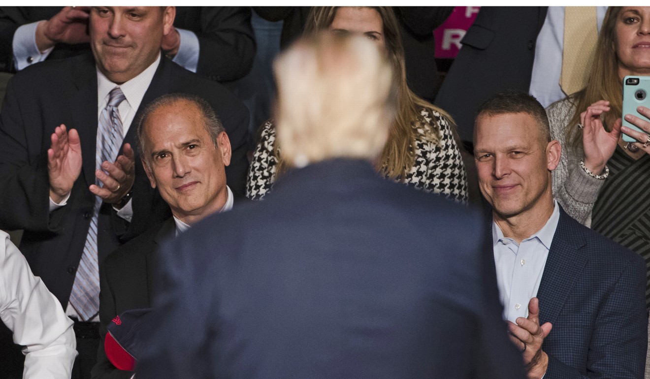In this December 15, 2016, photo, US Representatives Tom Marino, left, and Scott Perry, right, watch as President-elect Donald Trump departs a rally in Hershey, Pennsylvania. Photo: AP