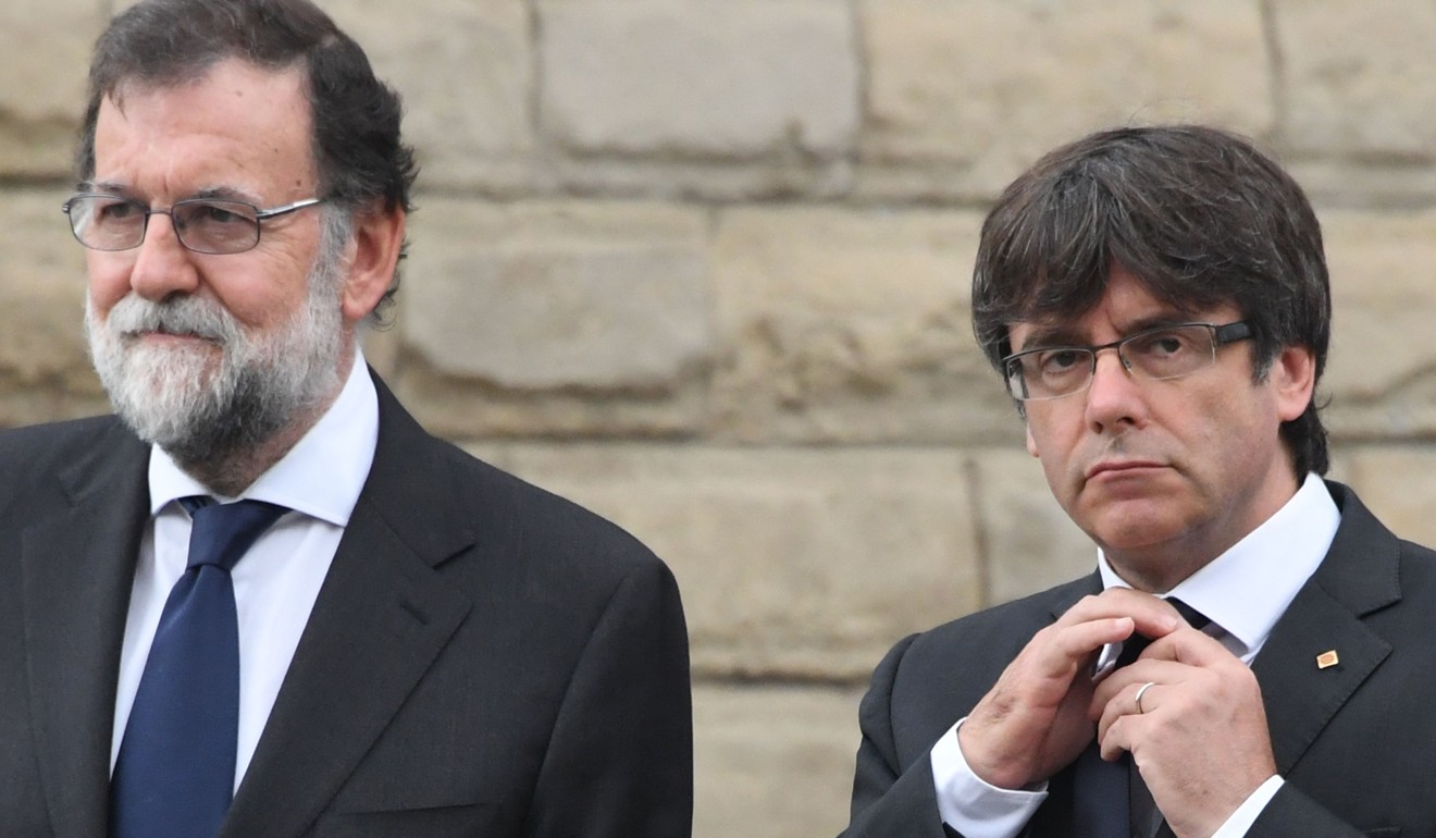 Spanish Prime Minister Mariano Rajoy with the president of Catalonia Carles Puigdemont. Photo: AFP