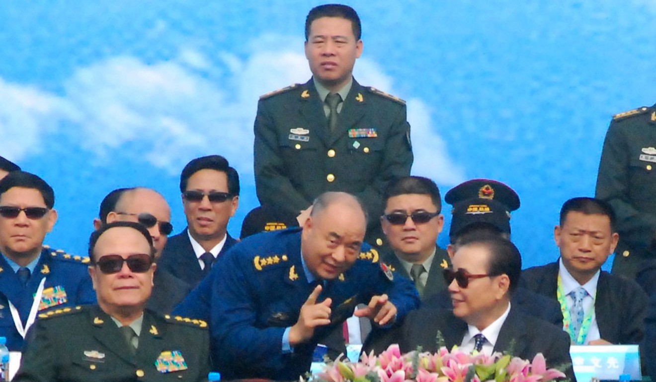 PLA Air Force commander General Xu Qiliang (centre) chats with former premier Li Peng, at the Zhuhai air show in 2010. Photo: Choi Chi-yuk