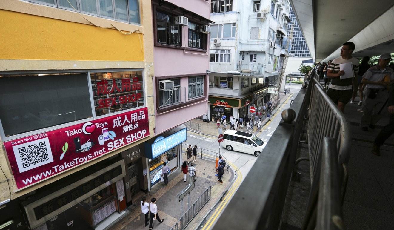A 90-inch outdoor screen facing a busy footbridge owned by the Take Toys sex shop was shut down at Yee On Mansion in O’Brien Road, Wan Chai. Photo: Xiaomei Chen