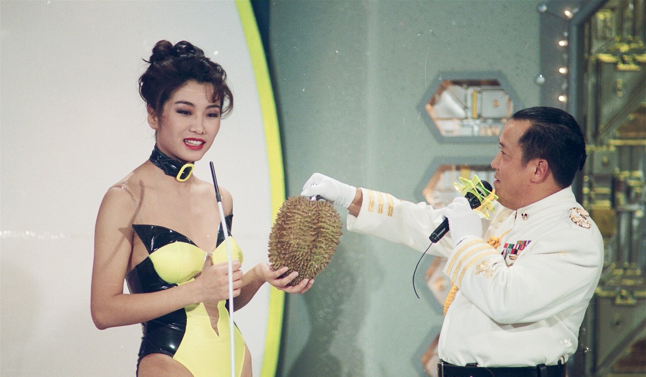 A Miss Hong Kong beauty pageant entrant receives a durian from master of ceremony Eric Tsang Chi-wai. File photo