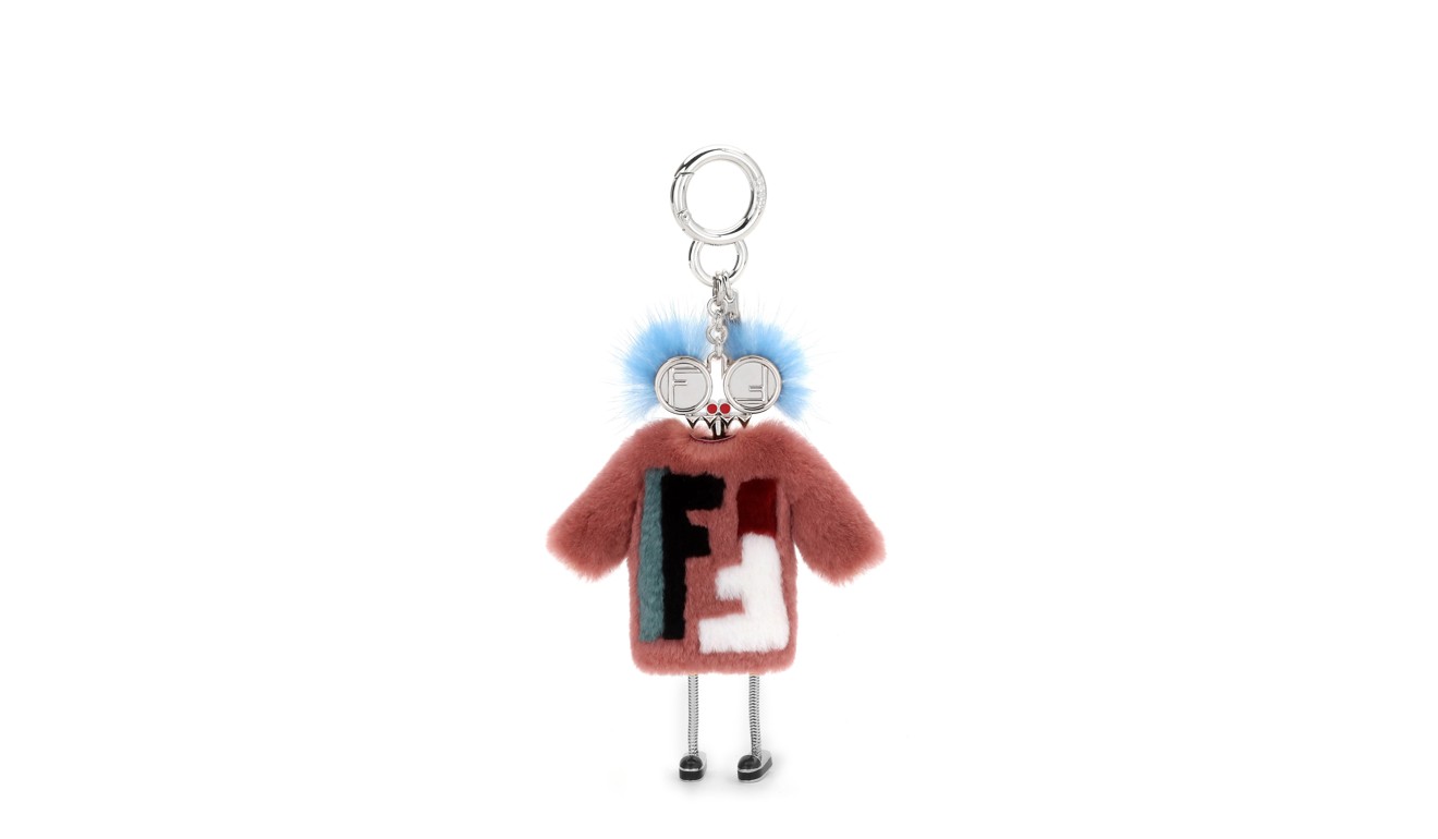 The mini witch bag charm, adorned with pink rabbit fur, features eyes in the shape of the fashion house’s new logo, adding a sense of playfulness to your look.