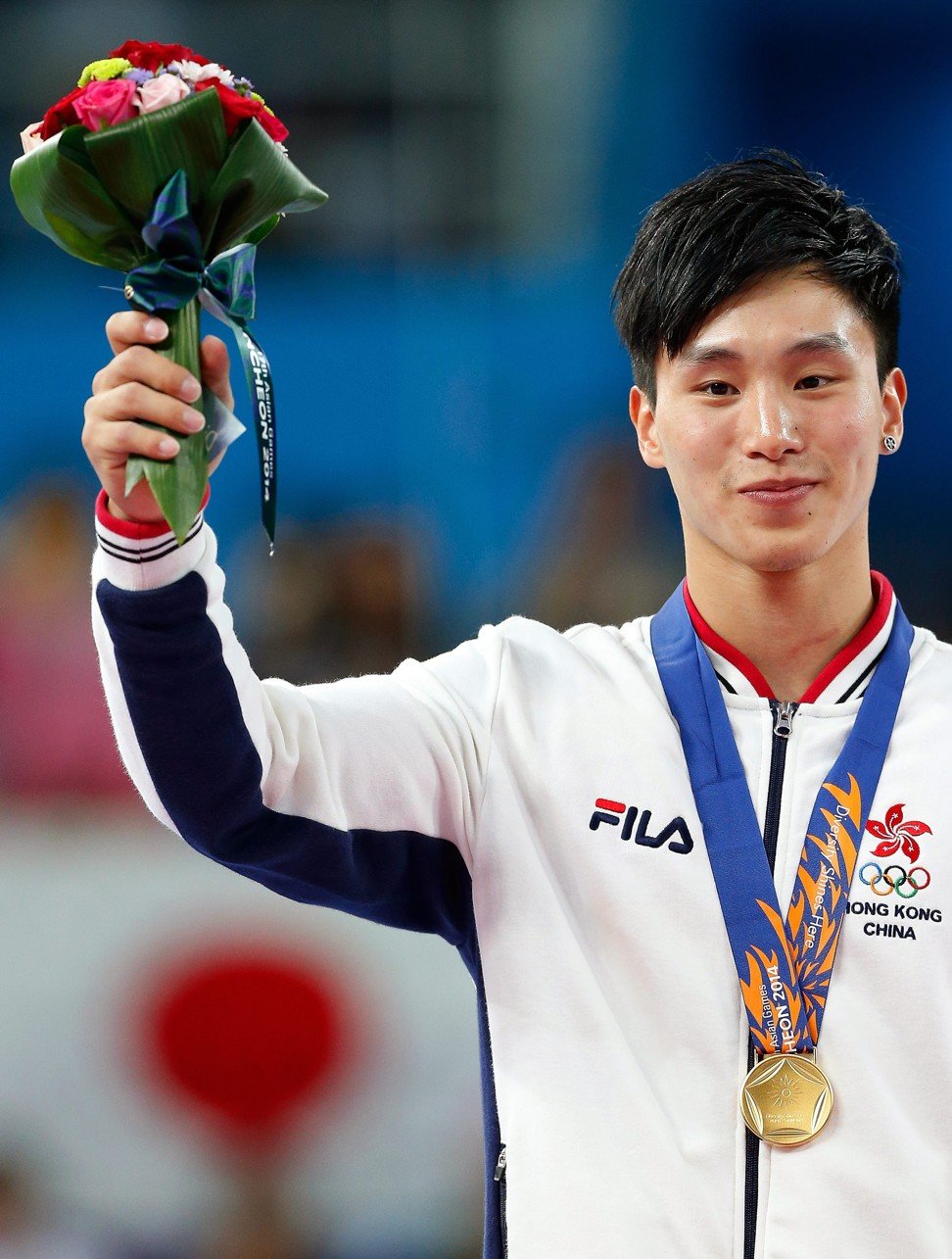 Stone Shek winning gold in the vault at the 2014 Incheon Asian Games. Photo: EPA