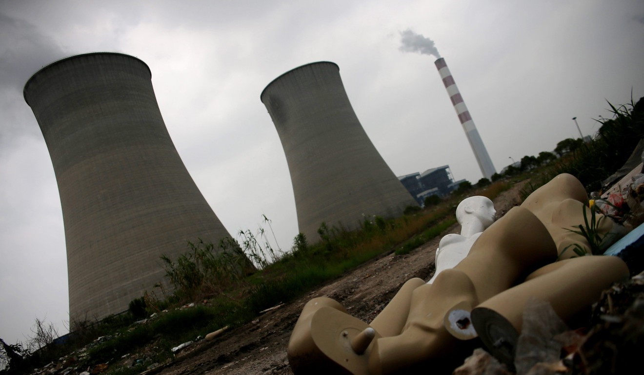 Plastic mannequins are dumped near the cooling towers and chimney of a power plant near Shanghai on World Environment Day in June 2014. The Chinese government has made green development a priority in recent years, recognising the seriousness of the state of its rivers, soil and air quality. Photo: EPA