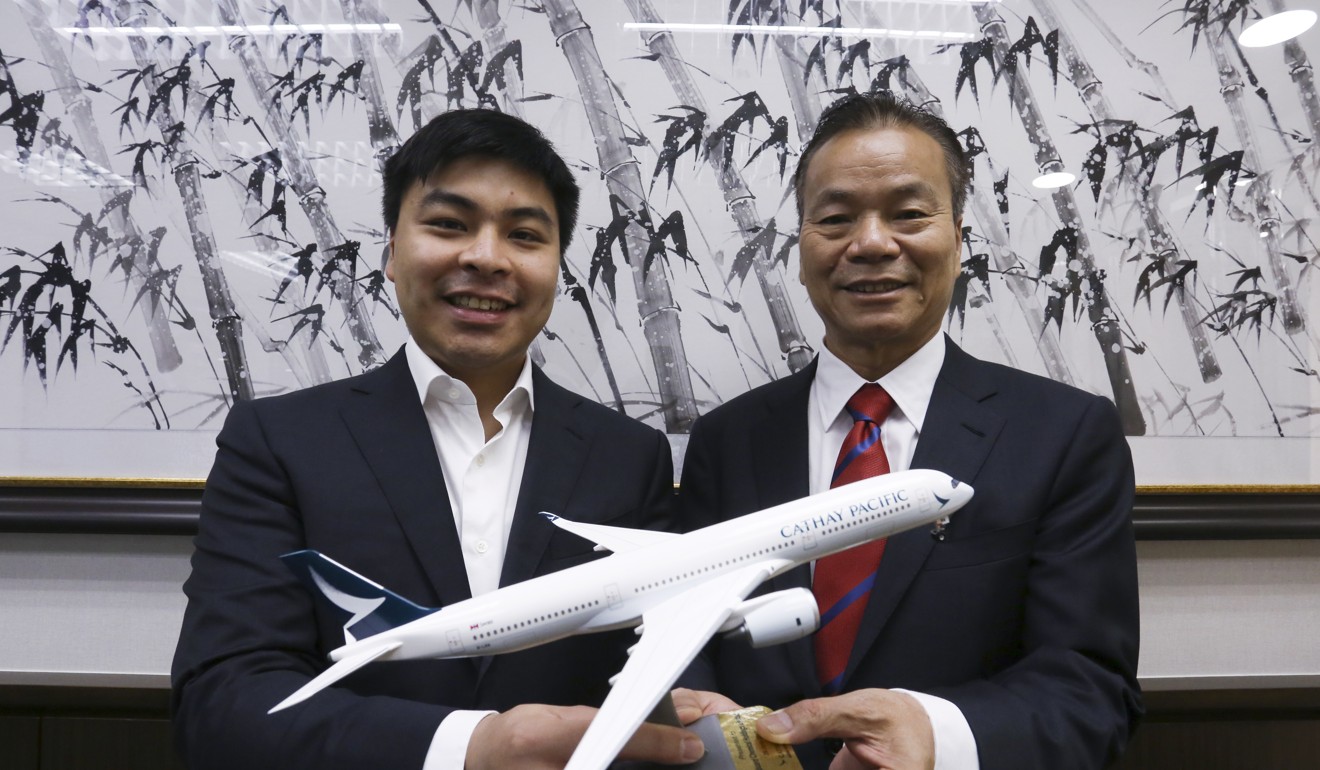 Kingboard Chemical Holdings founder Paul Cheung Kwok-wing (right), with his son Eric. The older Cheung had said he was a “long-term investor” in the airline. Photo: Jonathan Wong