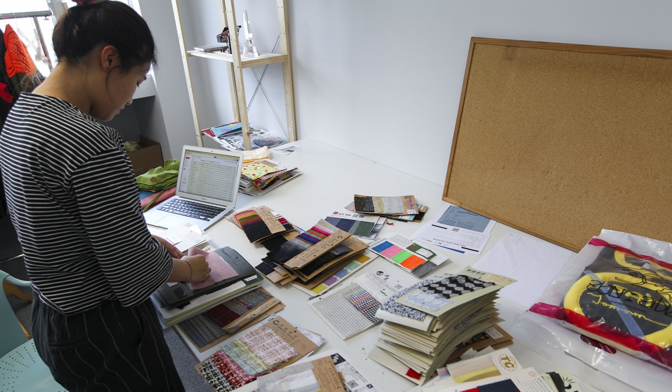 Staff work on projects at Kowloon Bay’s Design Incubation Centre. Photo: Roy Issa