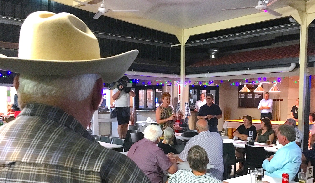 Local residents listen to Australian senator Pauline Hanson as she speaks in a pub in Bowen, Queensland. Photo: Reuters