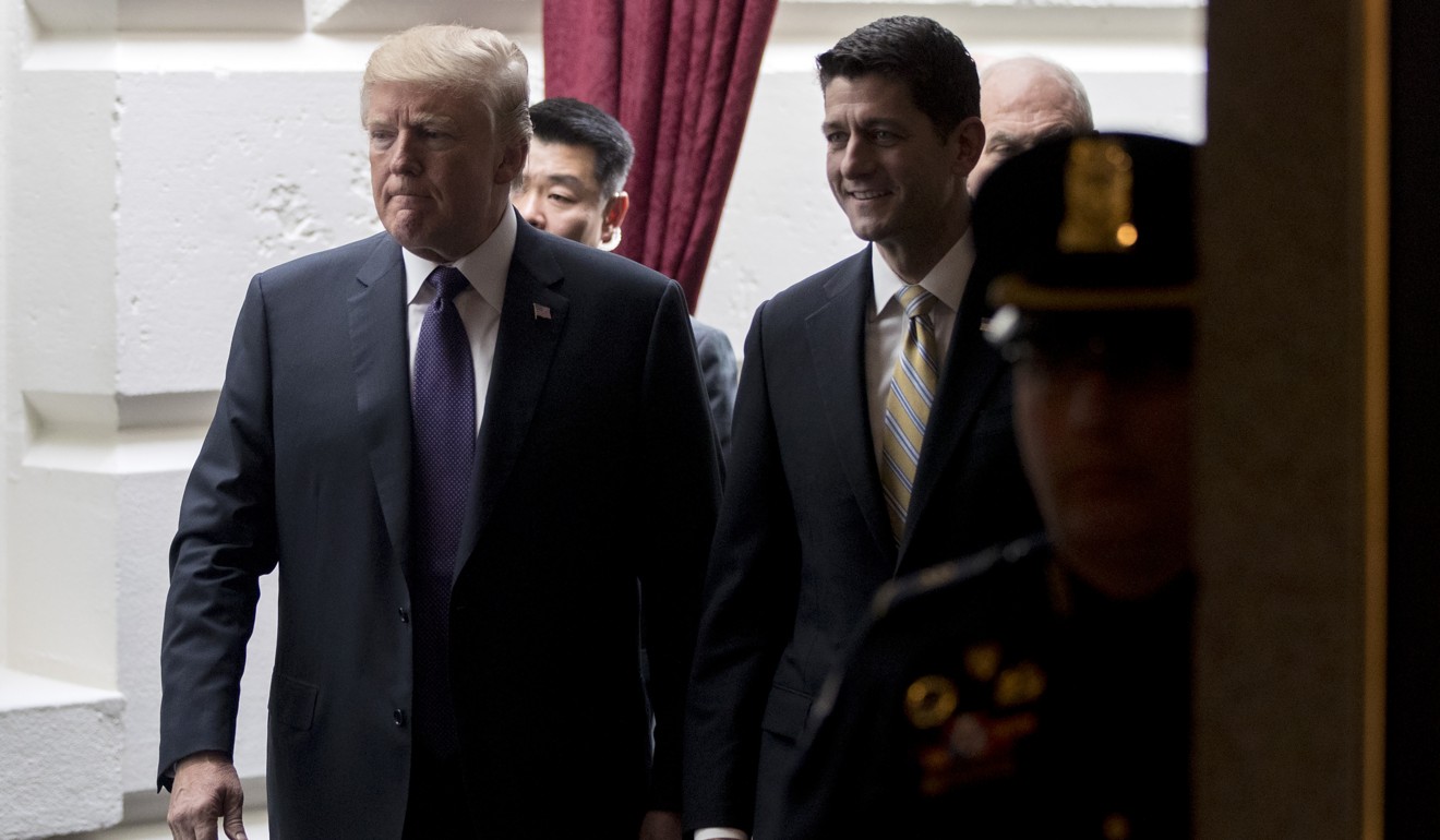 US President Donald Trump, left, and US House Speaker Paul Ryan, a Republican from Wisconsin, right, walk through the US Capitol. Photo: Bloomberg
