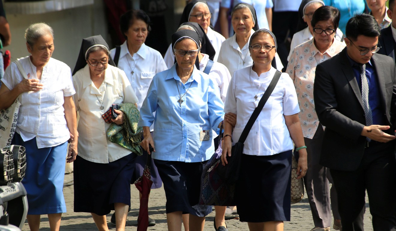 Nuns entering the Supreme Court compound at the start of the hearings. Photo: Reuters