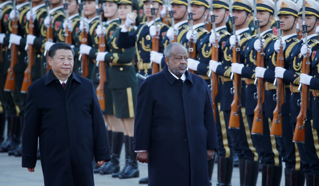 Chinese President Xi Jinping and Djibouti President Ismail Omar Guelleh inspect the honour guard during the welcoming ceremony in Beijing. Photo: Reuters