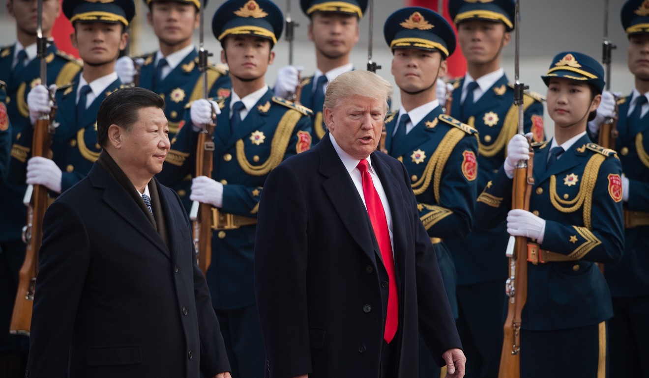 China's President Xi Jinping and US President Donald Trump review a Chinese honour guard at the Great Hall of the People in Beijing. Photo: AFP