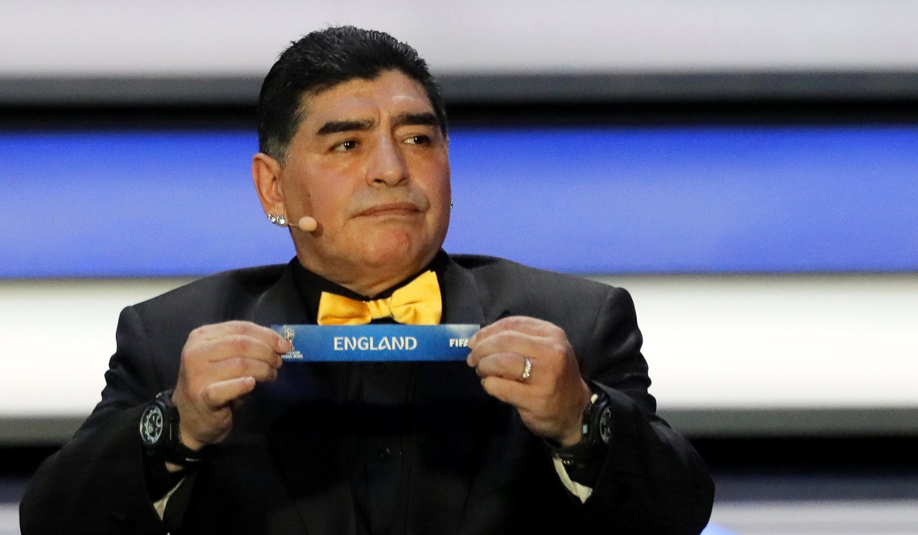 Argentina’s Diego Maradona shows the ticket of England during the Final Draw of the Fifa World Cup 2018 at the State Kremlin Palace in Moscow, Russia. Photo: EPA-EFE