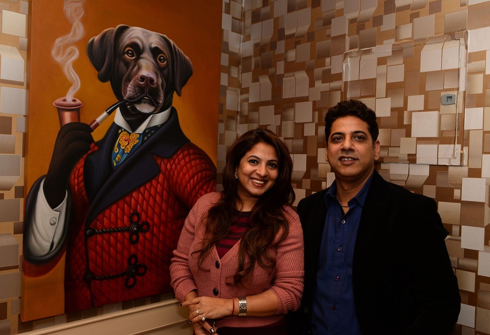 Deepak Chawla (right), owner and chief executive of luxury dog hotel Critterati in India, with his wife, Jaanwi Chawla, Photo: AFP