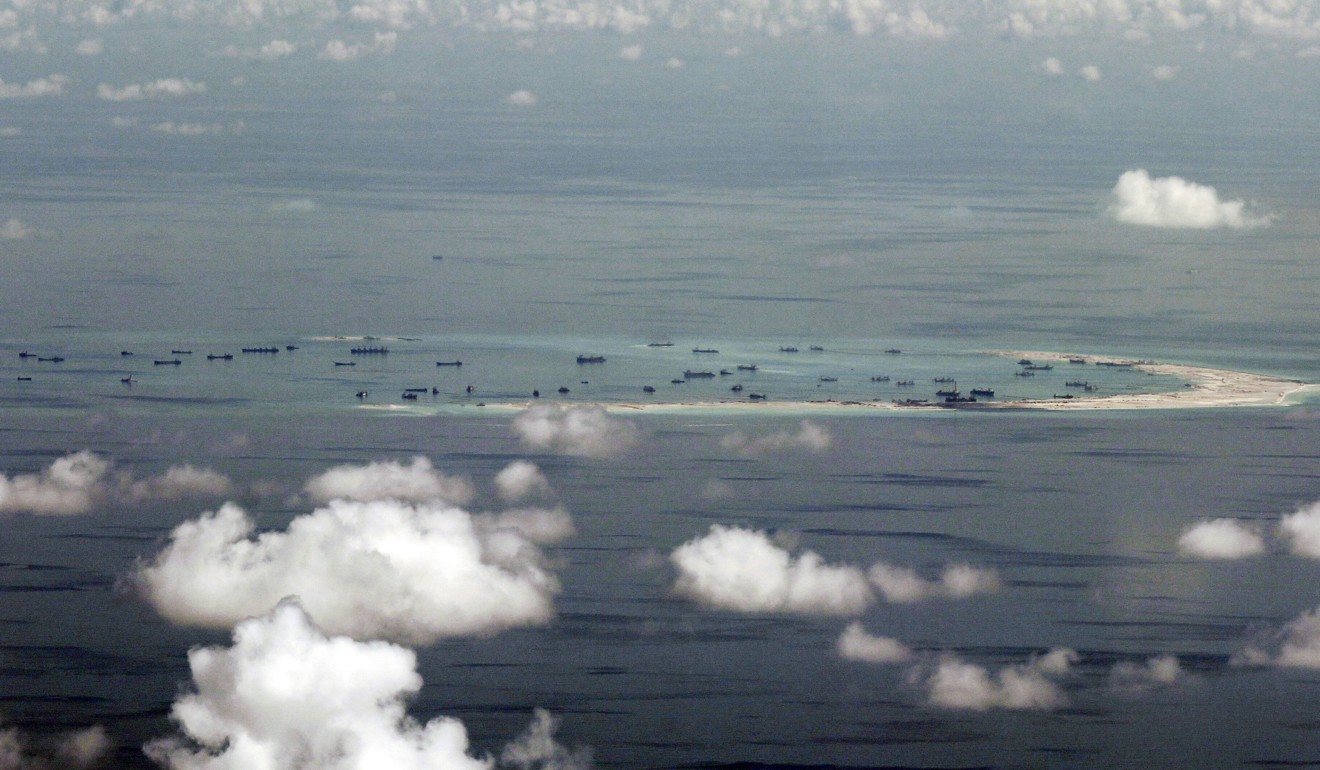 An aerial photograph taken from a military aircraft showing Chinese reclamation work on Mischief Reef in the Spratly Islands in a disputed area of the South China Sea. Photo: AFP