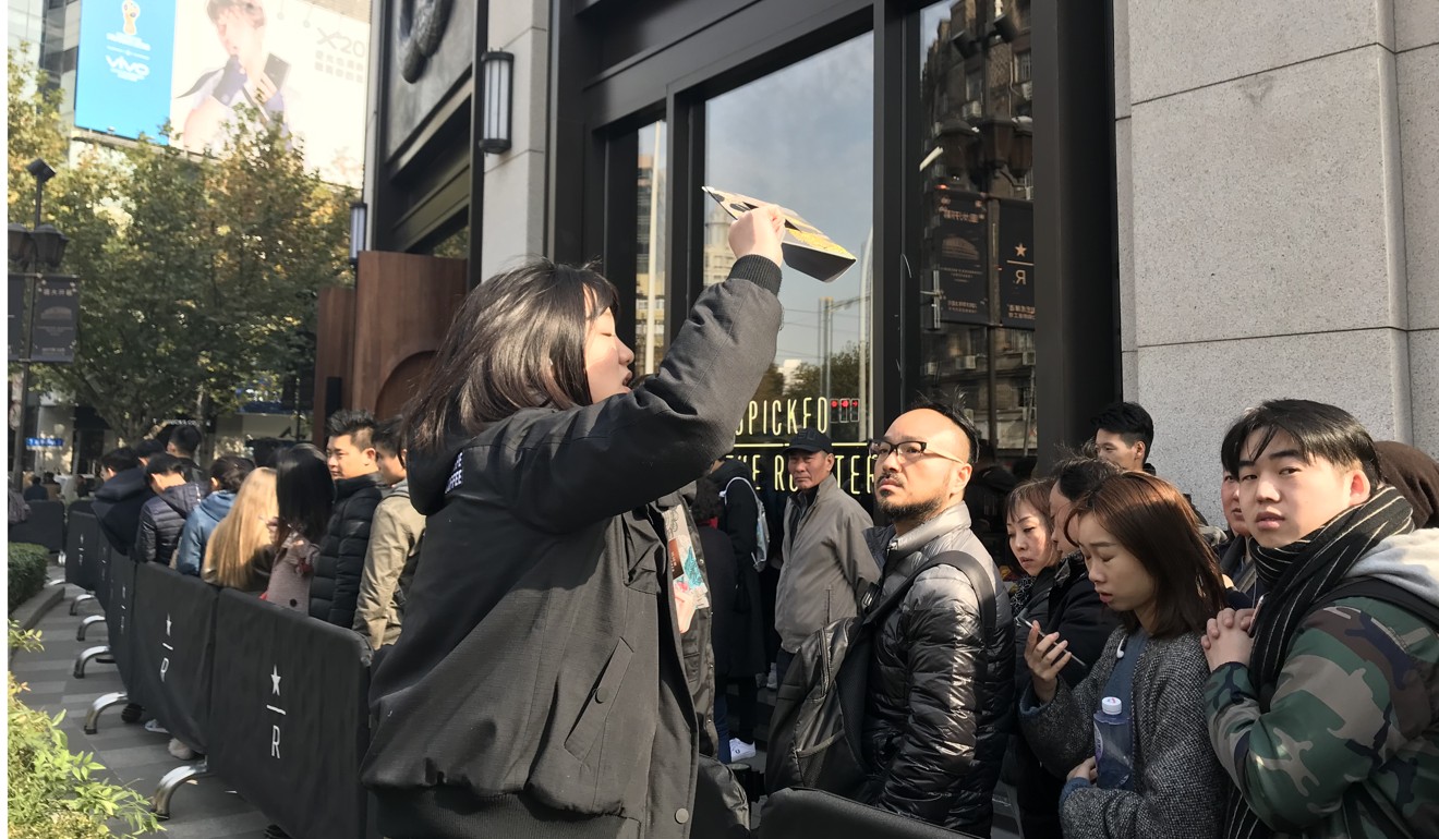 The opening debut of the Starbucks Reserve Roastery in Shanghai drew crowds that had to wait for up to an hour before being served. Photo: Daniel Ren