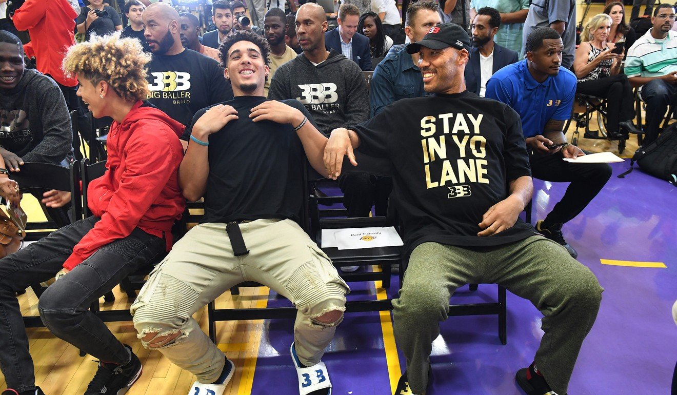 LaVar Ball sits with his other sons LaMelo (left) and LiAngelo as the Los Angeles Lakers hold a news conference introducing the Lakers' first-round draft pick, second overall, Lonzo Ball in June. Photo: TNS